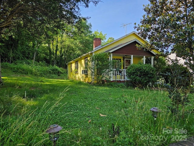 view of property exterior with a porch