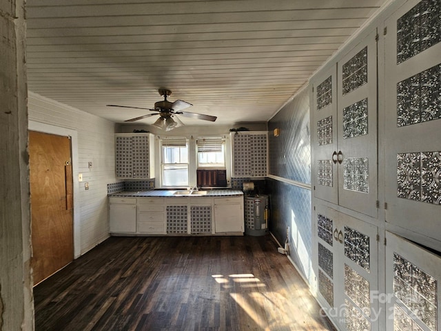 kitchen with sink, white cabinets, ceiling fan, and dark hardwood / wood-style floors