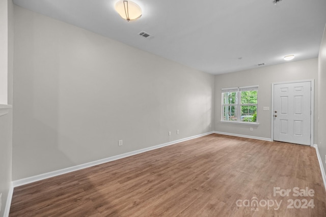 unfurnished room featuring wood-type flooring