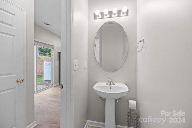 bathroom featuring wood-type flooring