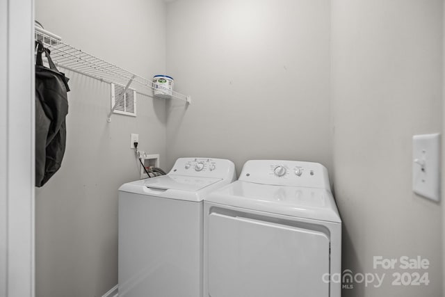 washroom with washing machine and dryer