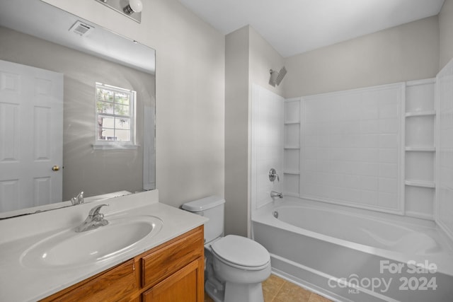 full bathroom featuring tile patterned floors, vanity, toilet, and tub / shower combination