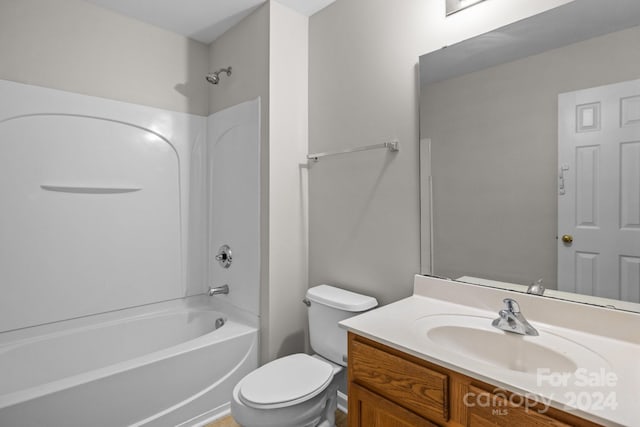 full bathroom with shower / tub combination, vanity, and toilet