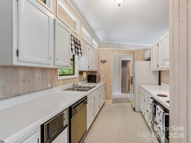 kitchen with white range, white cabinetry, sink, light tile flooring, and dishwasher