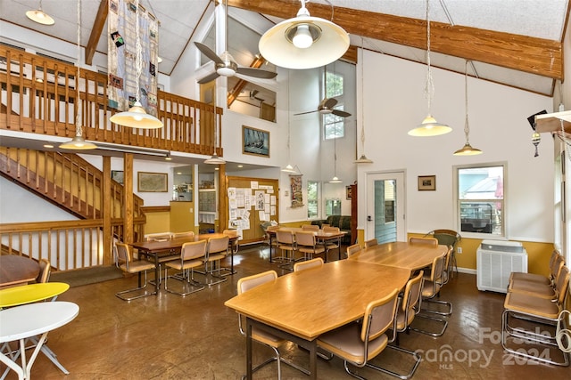 dining room featuring ceiling fan, plenty of natural light, beam ceiling, and high vaulted ceiling