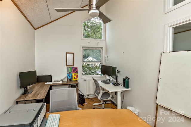 home office with plenty of natural light, high vaulted ceiling, and ceiling fan