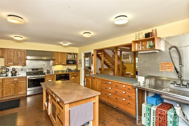 kitchen featuring open shelves, concrete floors, wall chimney exhaust hood, black appliances, and brown cabinetry