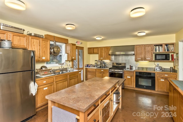 kitchen with open shelves, a sink, wall chimney range hood, brown cabinets, and black appliances