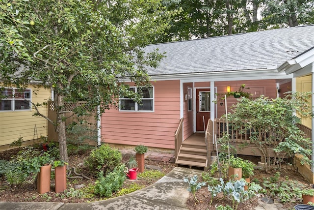 view of front of property with a shingled roof