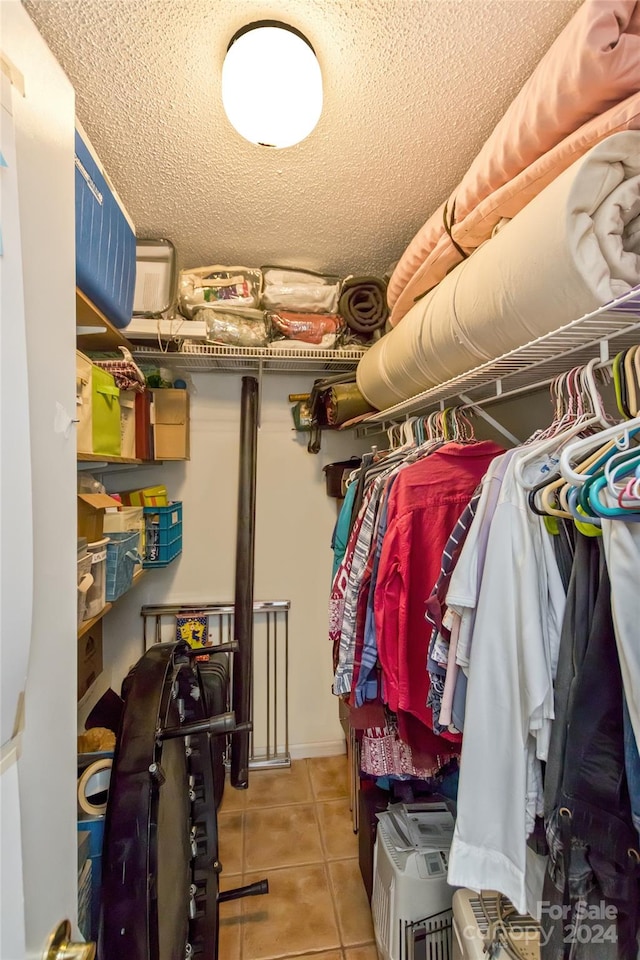 spacious closet featuring light tile patterned flooring