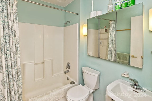 full bathroom featuring shower / tub combo, toilet, and sink