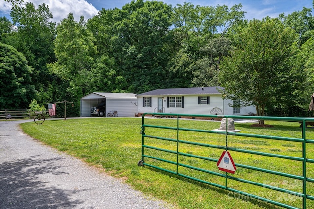 view of front of house featuring a front lawn and a carport