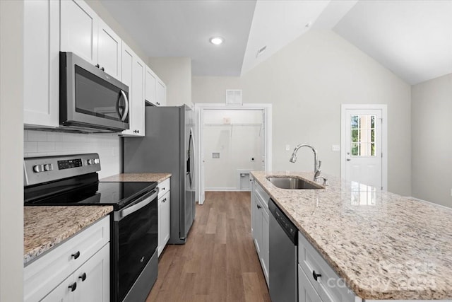 kitchen with hardwood / wood-style flooring, sink, white cabinetry, and stainless steel appliances