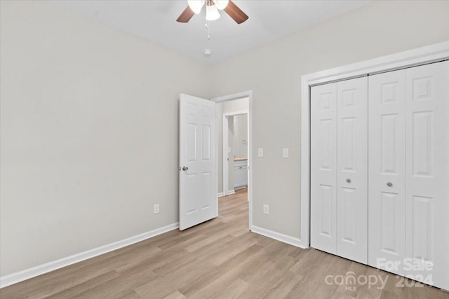 unfurnished bedroom with a closet, ceiling fan, and light hardwood / wood-style flooring