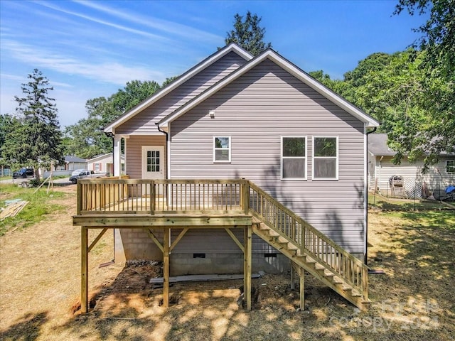 back of property with a wooden deck