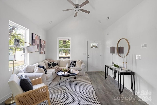 living room featuring hardwood / wood-style floors, high vaulted ceiling, ceiling fan, and a wealth of natural light