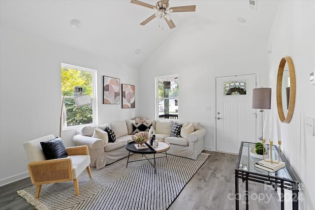 living room featuring wood-type flooring, high vaulted ceiling, and ceiling fan