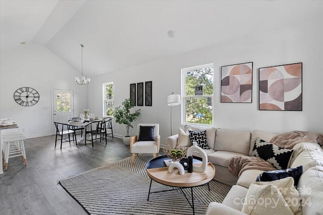 living room with a chandelier, dark hardwood / wood-style floors, and high vaulted ceiling