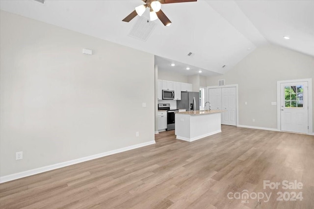 unfurnished living room with ceiling fan, light hardwood / wood-style floors, sink, and high vaulted ceiling