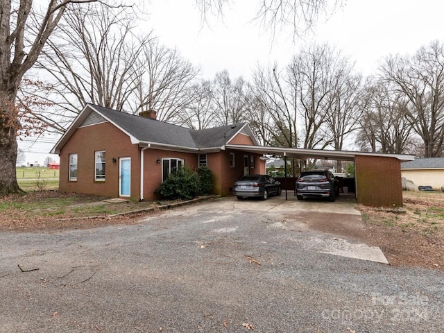 single story home with a carport