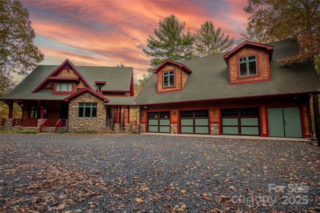 view of front of house with a porch and a garage