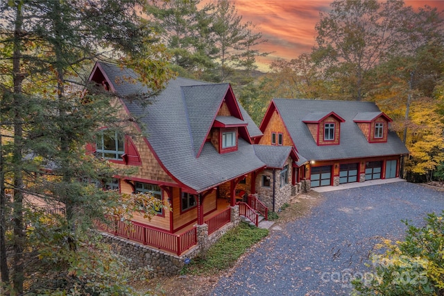 view of front of house with covered porch and a garage