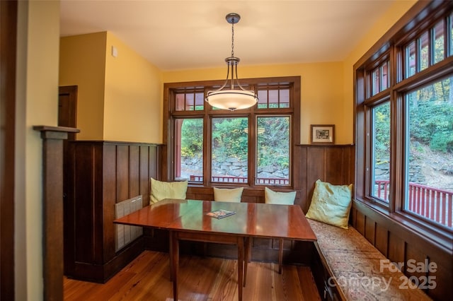 dining room featuring light hardwood / wood-style flooring and breakfast area