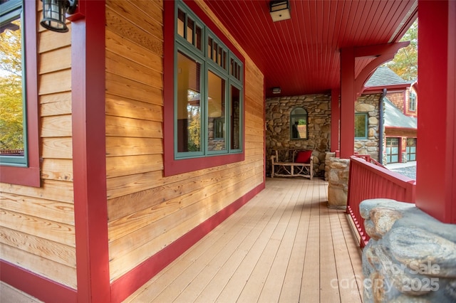 wooden terrace featuring a porch