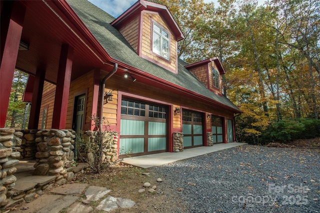 view of side of home featuring a garage