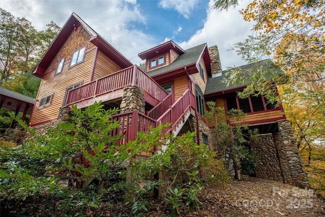 back of house featuring a deck