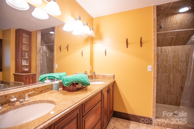 bathroom featuring vanity and a tile shower