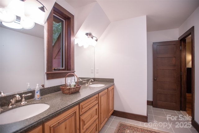 bathroom with tile patterned floors and vanity