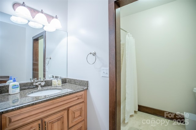 bathroom featuring tile patterned floors and vanity