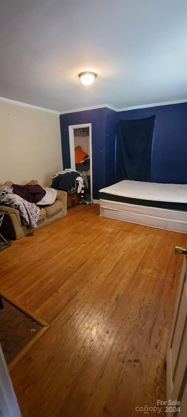 bedroom with hardwood / wood-style floors