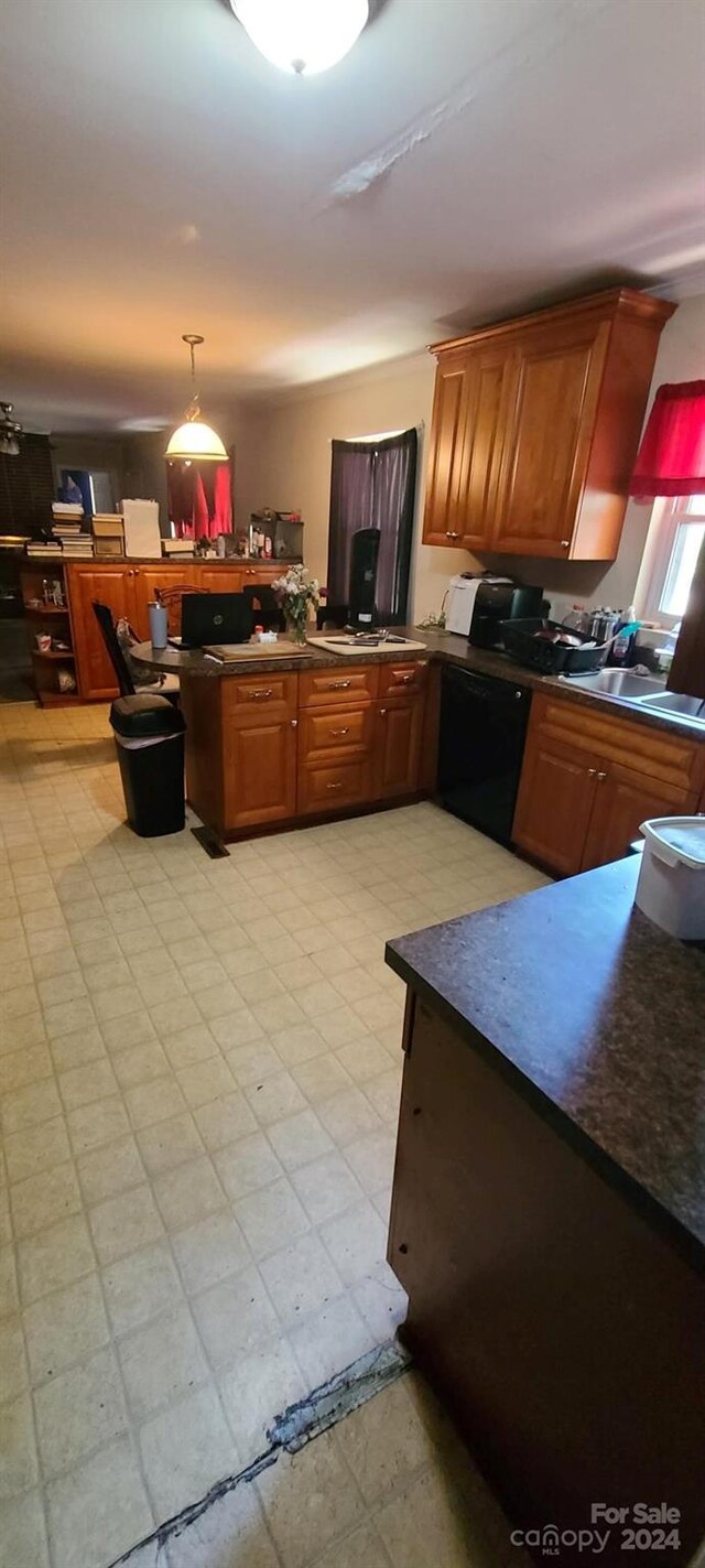 kitchen with kitchen peninsula, dishwasher, pendant lighting, and light tile patterned floors