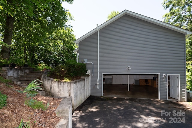 view of property exterior with a garage