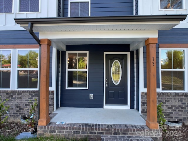 doorway to property with covered porch