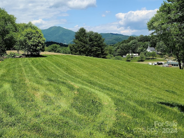 exterior space with a rural view and a mountain view