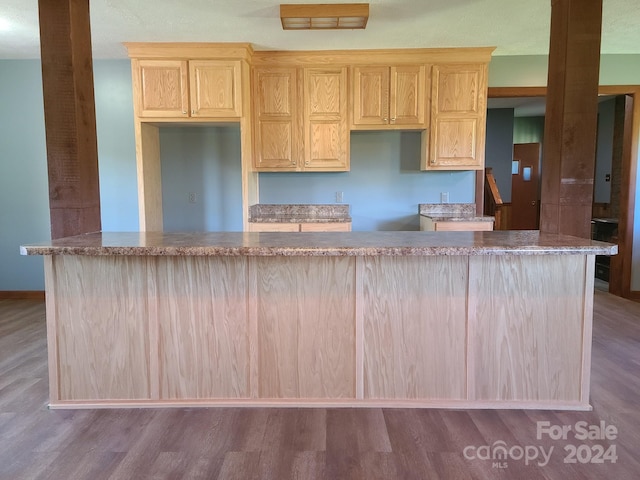 kitchen featuring light brown cabinets and light wood-type flooring