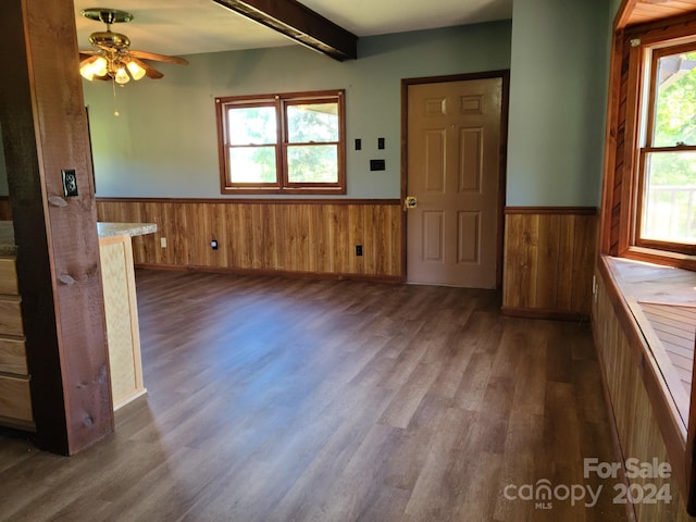 interior space with ceiling fan and dark hardwood / wood-style floors