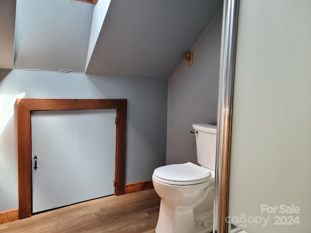 bathroom featuring toilet and hardwood / wood-style floors