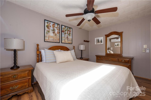 bedroom featuring hardwood / wood-style floors and ceiling fan