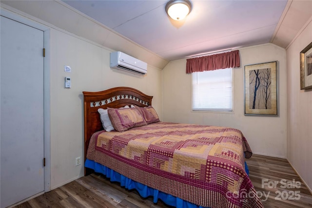 bedroom featuring wood-type flooring, lofted ceiling, and a wall unit AC