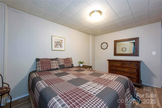 bedroom featuring wood-type flooring