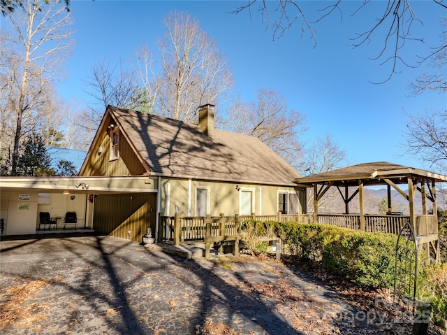 view of front of property with a carport