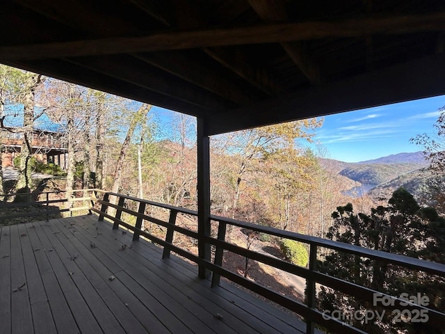 wooden terrace featuring a mountain view