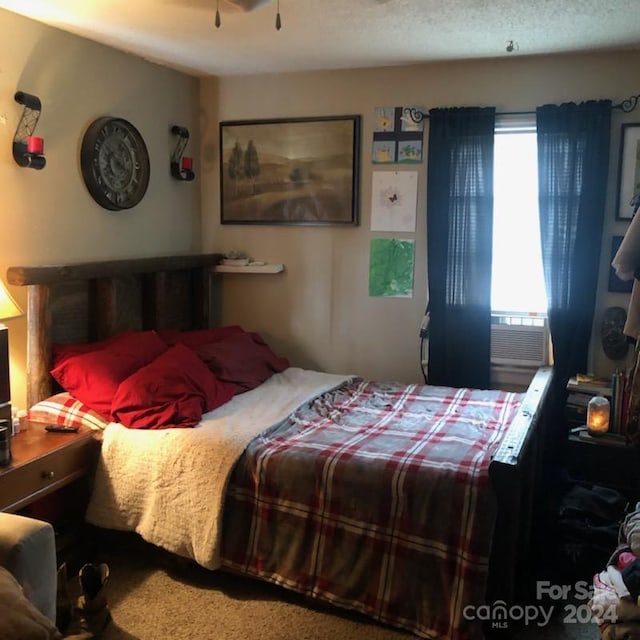 bedroom featuring carpet floors and cooling unit