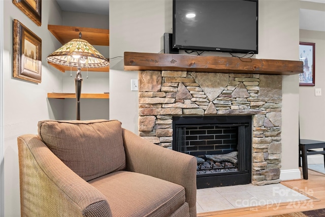 sitting room featuring light hardwood / wood-style floors and a fireplace