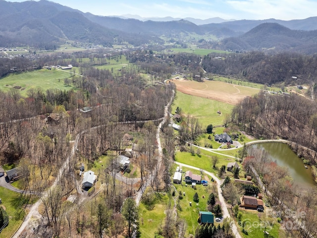 aerial view featuring a water and mountain view