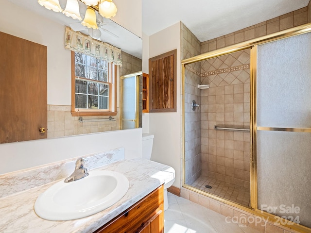 bathroom with vanity, tile patterned floors, and walk in shower